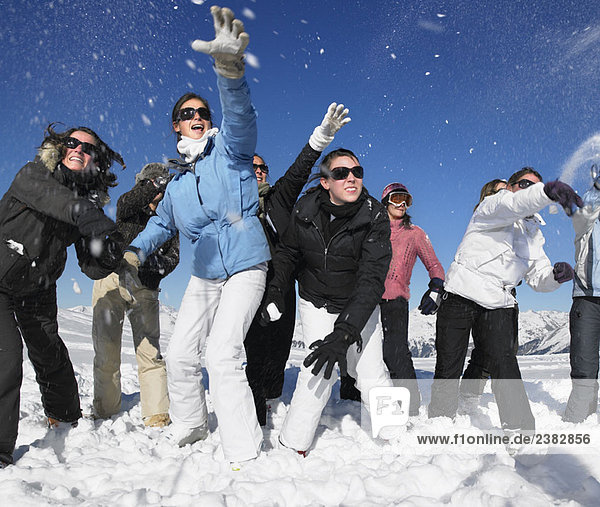 Group throwing snowballs