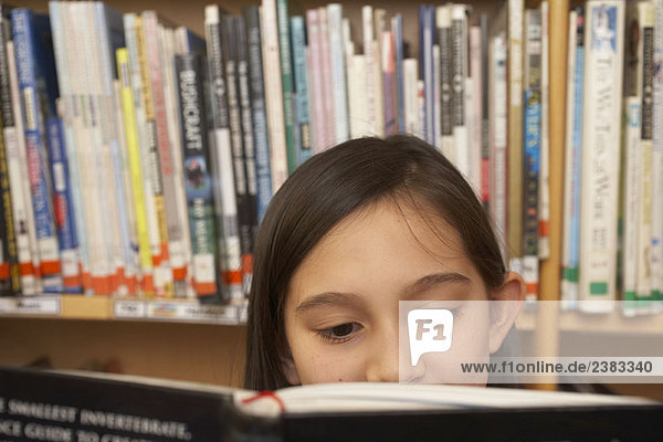 Girl reading a book  close up