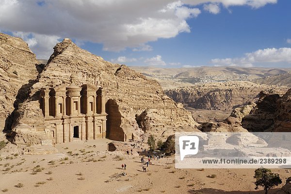 High angle view of tourists in front of monastery  Petra  Wadi Musa  Jordan