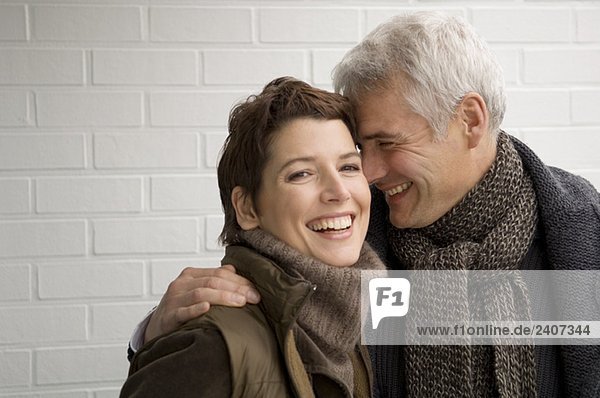 Portrait of a mature man and a mid adult woman romancing