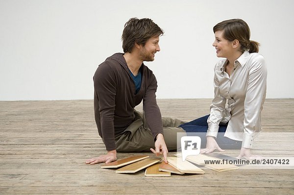 Couple choosing laminated boards