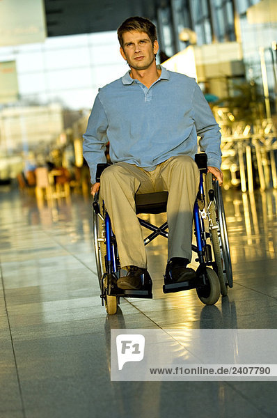 Mid adult man sitting in a wheelchair