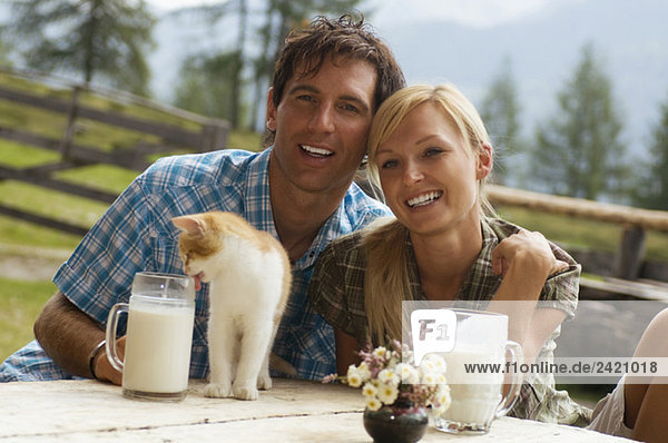 Austria  Salzburger Land  couple drinking milk