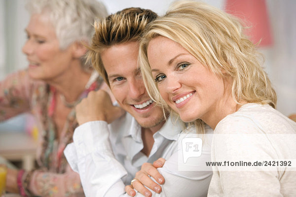 Family at dining table  smiling