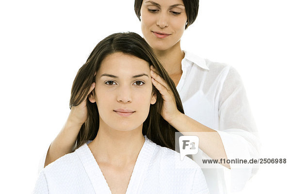 Woman receiving head massage  looking at camera