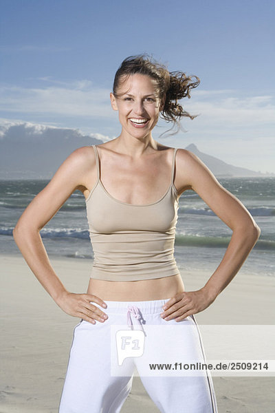 South Africa  Cape Town  Young woman exercising on beach  portrait