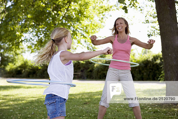 Mother and daughter with hula-hoop