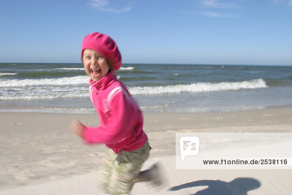 Girl Running on Beach  Baltic Sea  Poland