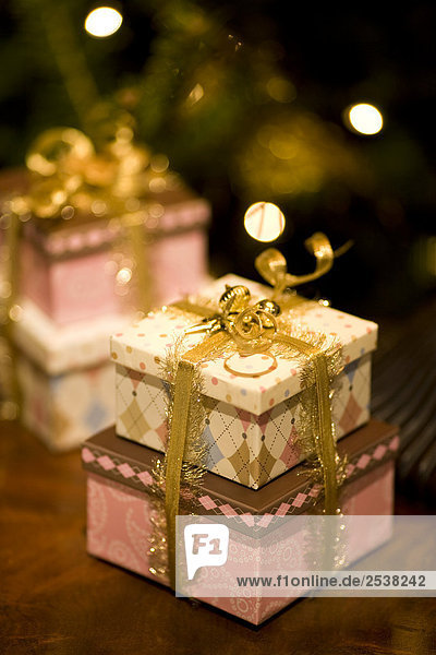 Wrapped Christmas Gifts with Decorated Tree