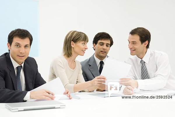 Business people in meeting  discussing document