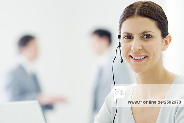 Female telemarketer smiling at camera  portrait