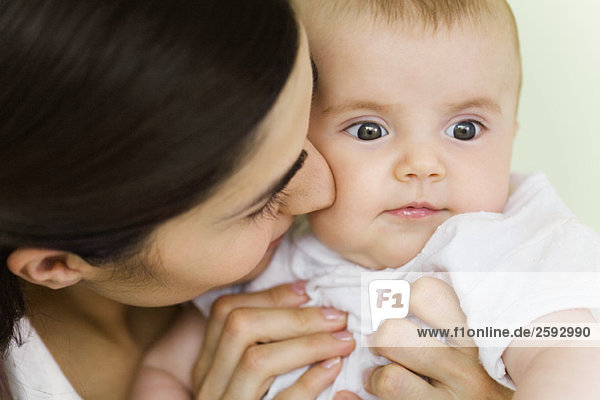 Woman nuzzling baby  close-up