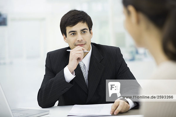 Businessman listening carefully to client