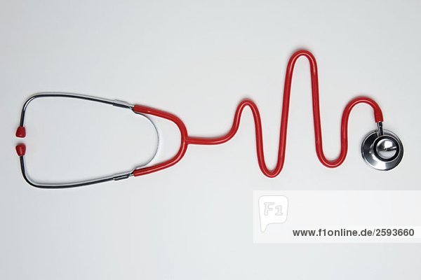 A stethoscope in the shape of a normal EKG graph