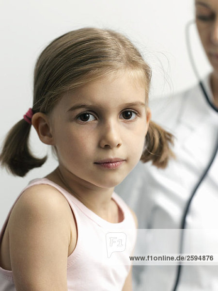 A young girl getting a medical Exam