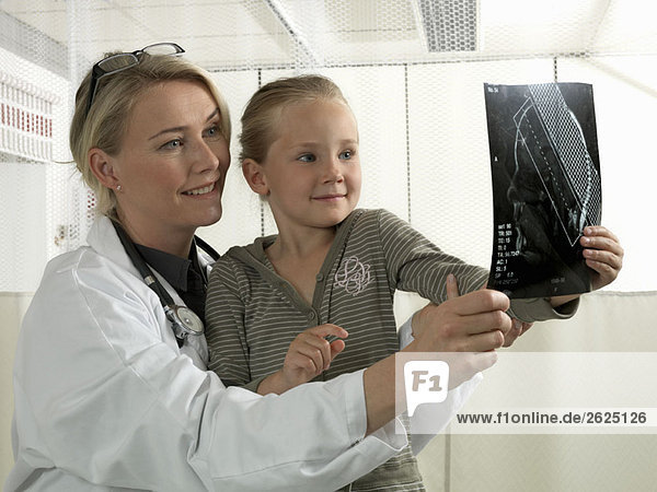 Doctor and girl with x-ray