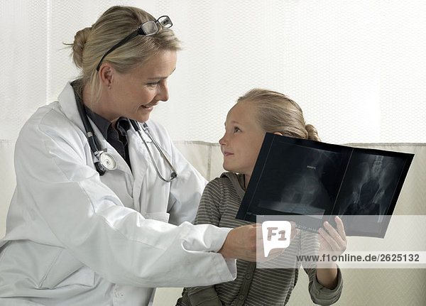 Doctor and girl with x-ray