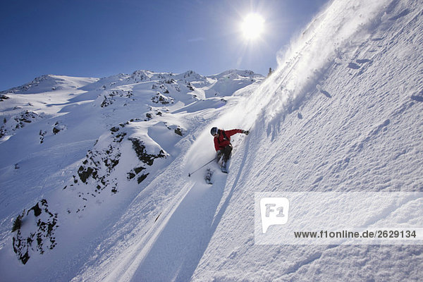 Austria  Tyrol  Zillertal  Gerlos  Freeride  Man skiing downhill