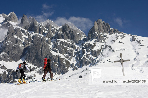 Austria  Salzburger Land  Hochkoenig mountain  Couple on skis hiking