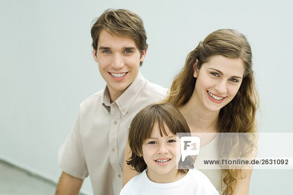 Family smiling at camera  portrait
