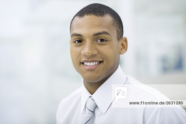 Young professional man smiling at camera  portrait