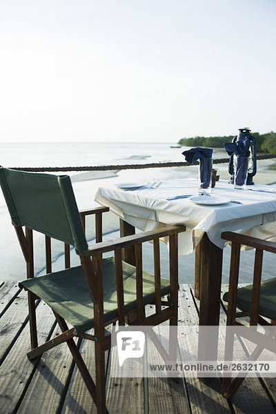 Casual dinner table overlooking sea