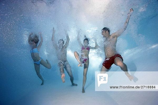 Group underwater in swimming pool