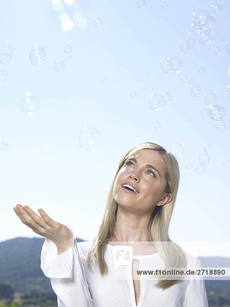 Girl looking at bubbles