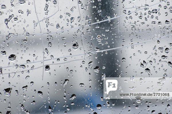 Raindrops on window pane  full frame  close-up