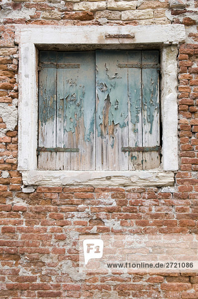 Italy  Venice  Old brick wall  window  closed shutters