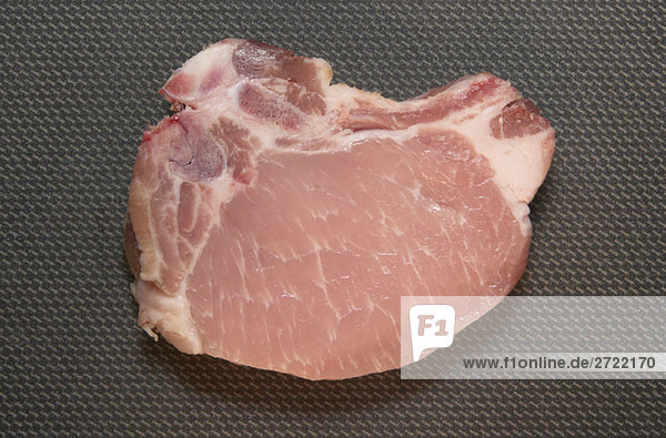 Raw pork chop  elevated view