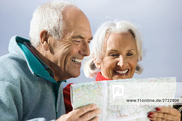 Germany  Bavaria  Walchensee  Senior couple looking at map