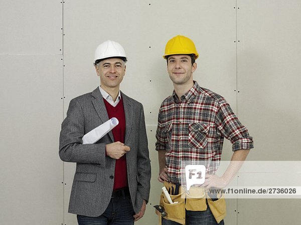 An architect and a construction worker  portrait