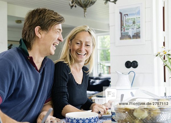 Happy couple in kitchen