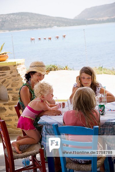 Scandinavian family having lunch Greece.