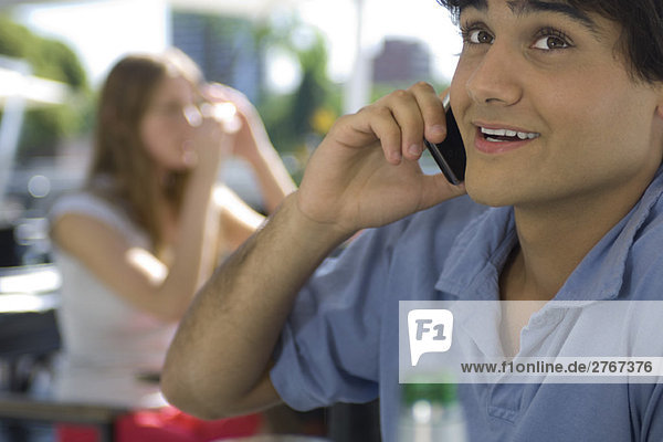 Young man talking on cell phone  close-up