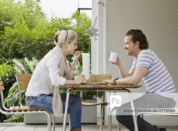 Man and woman eating a meal together