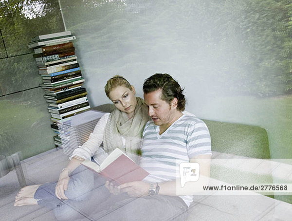 Man and woman reading together