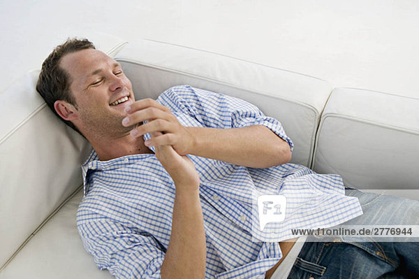 A man lying on sofa