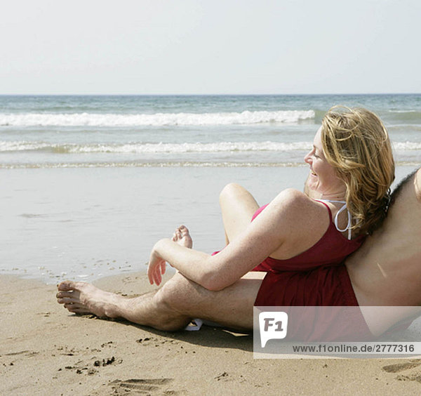woman relaxing by beach