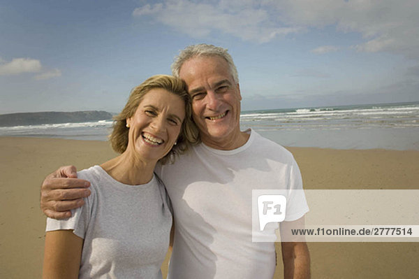 Portrait of couple smiling on a beach