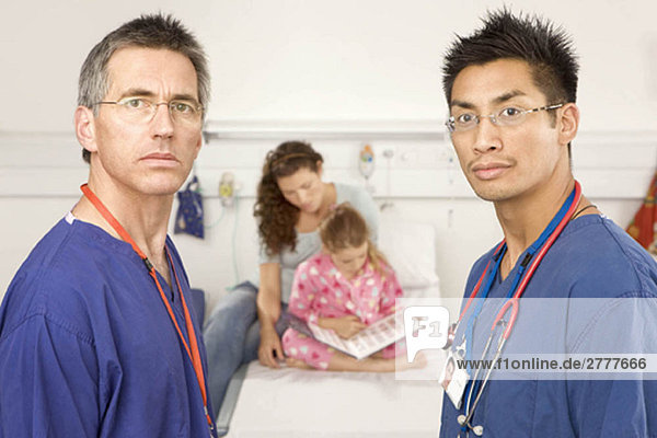 A portrait of two doctors and a patient