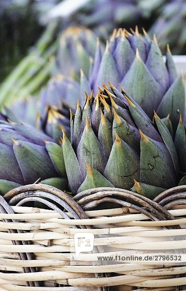 Italian artichokes (with spines) in a basket
