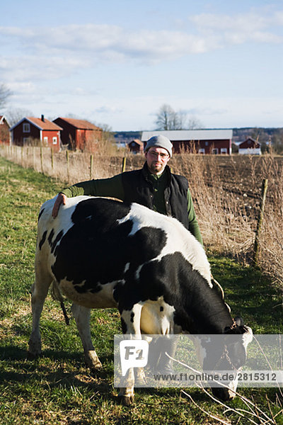 A farmer and a cow Sweden.