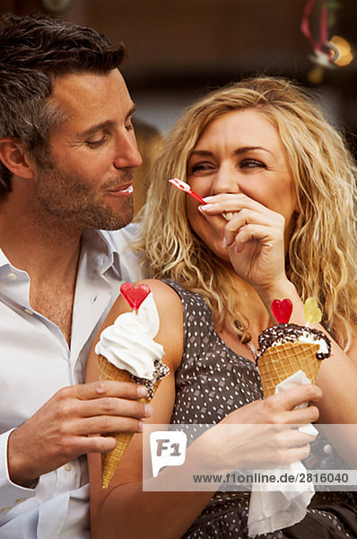 A couple having ice cream Copenhagen Denmark.