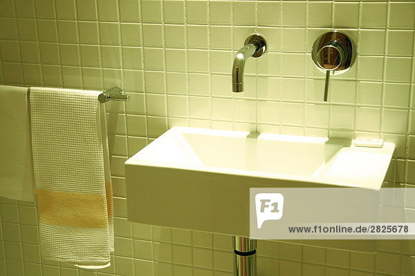 Towel rail and washbasin in bathroom