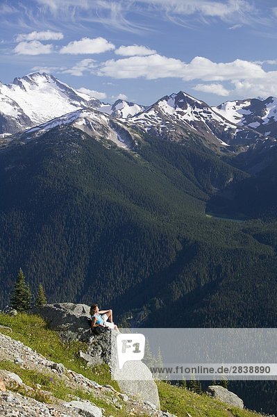 woman hiking in Whistlers backcountry in summer  British Columbia  Canada.
