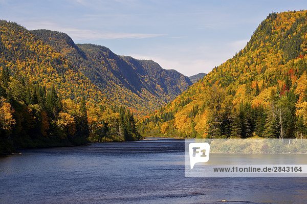 Riviere Jacques-Cartier  Jacques Cartier River  and valley surrounded by fall colours in Parc de la Jacques-Cartier  Quebec  Canada.