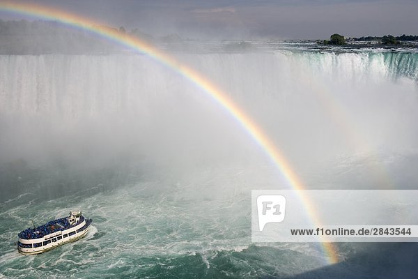 Horseshoe Falls and the American Falls and rainbow over the Maid of the Mist boat ride at Niagara Falls  Ontario  Canada