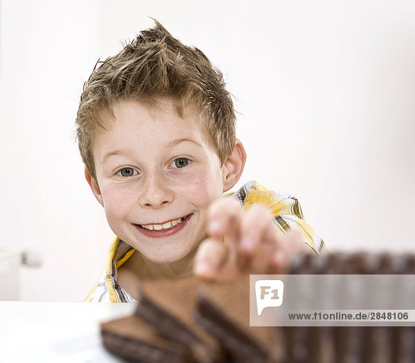 Boy having chocolate pastry